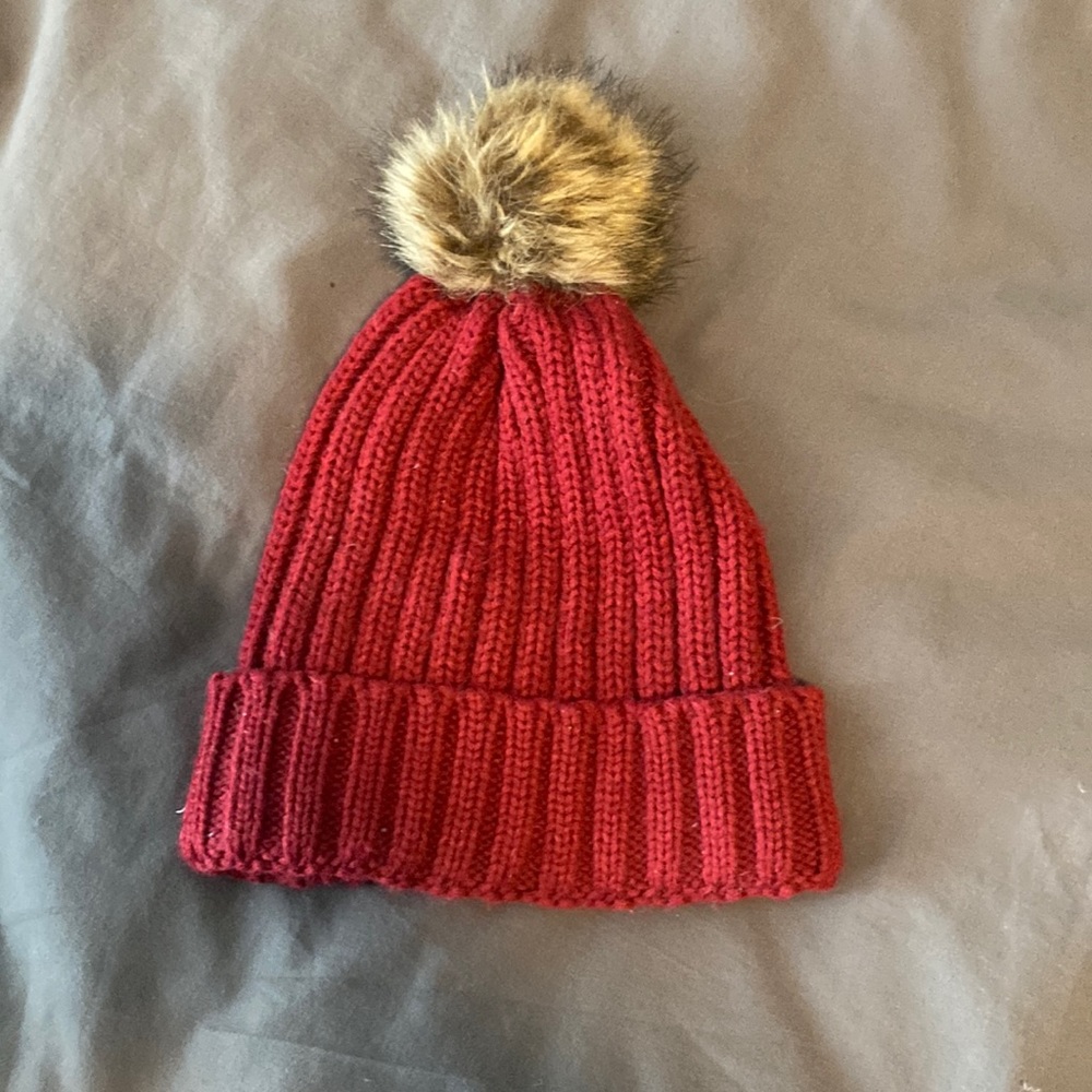 Winter hat with fur ball